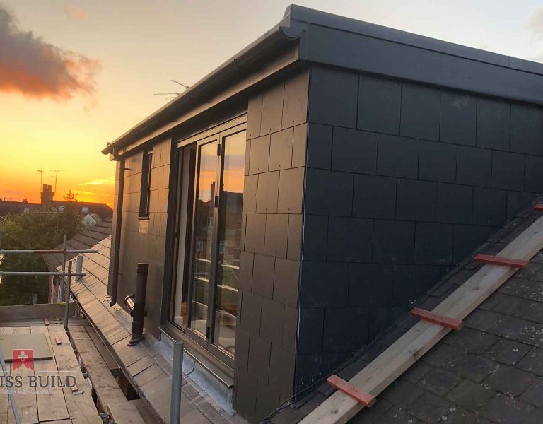 new dormer structure and rear opening during construction.